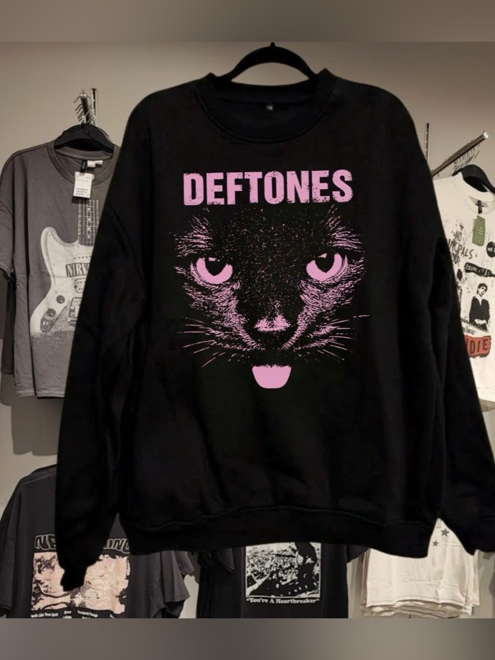 Black Deftones crewneck sweatshirt featuring the signature pink cat graphic and